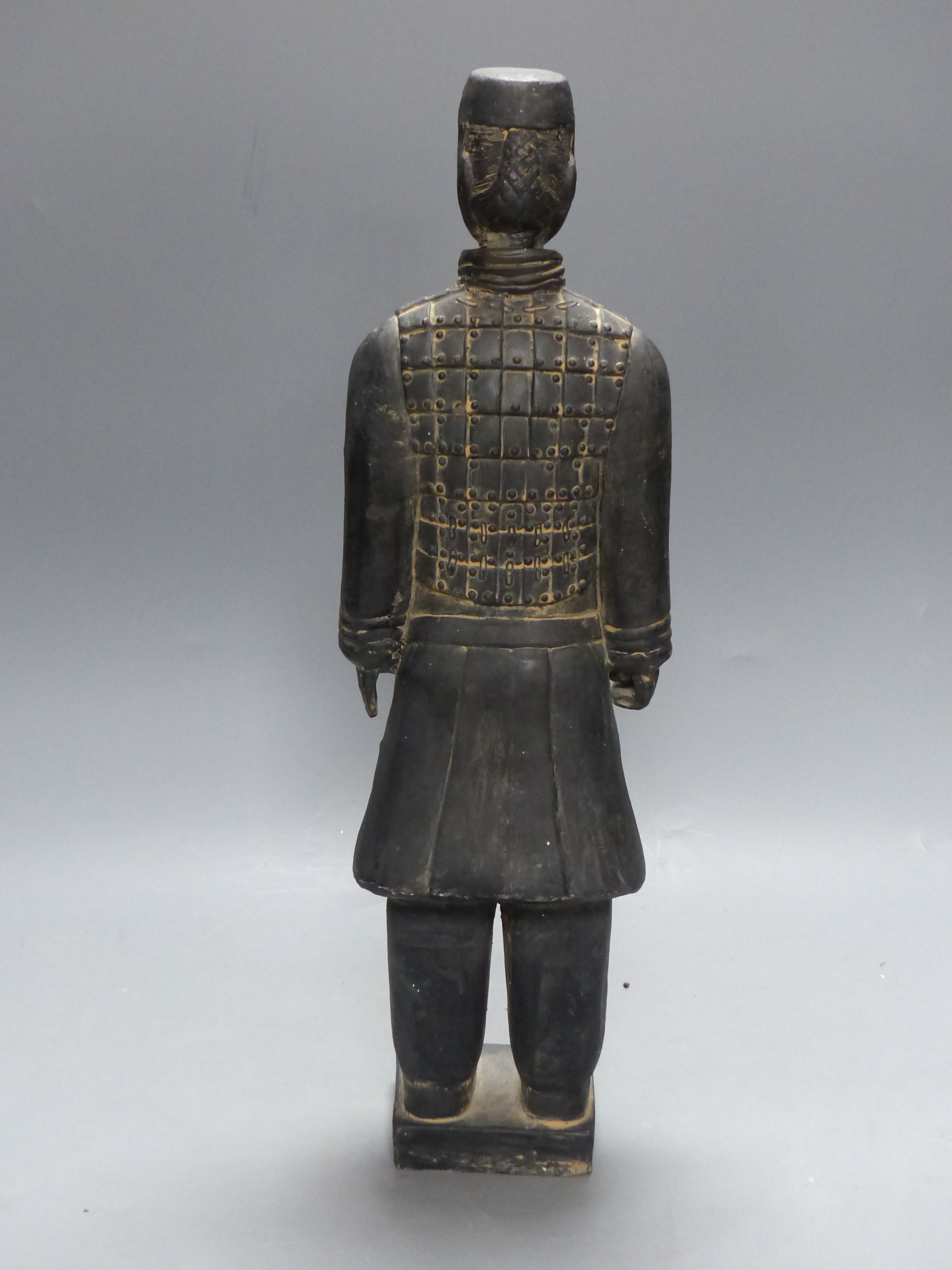 A Chinese grey pottery figure in Han style, height 47cm